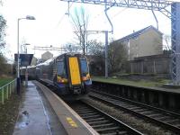 380004 with the 14.30 Paisley Canal - Glasgow Central at Corkerhill on 19 November 2012 following the completion of branch electrification work.<br><br>[John Yellowlees 19/11/2012]