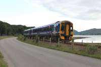 There may not be much traction variety on the Kyle line but there are plenty of opportunities to get close to the lineside, not least around Strathcarron and Attadale. 158707 runs between the road and tidal Loch Carron as it heads for Kyle with the last train of the day, the 1757 from Inverness, on 13 July 2012. <br><br>[Mark Bartlett 13/07/2012]