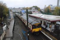 A Dalmuir bound service leaving Hyndland station with the new footbridge and lifts beyond the station building. The view is from the current footbridge.<br><br>[Ewan Crawford 14/11/2012]