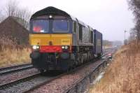 DRS 66427 leaves Blackford on 20 November with one of three trial runs of containers from the Highland Spring bottling plant to Coatbridge FLT. The train is heading for Perth where it will reverse. [See image 41100]<br><br>[Bill Roberton 20/11/2012]