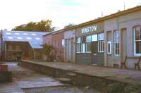 The much modified remains of the 1856 station at Winston on the Darlington and Barnard Castle line in 1977. The station closed to passengers in 1964, with this section of the line closing completely a year later. The redundant site was subsequently taken over by a local road transport company.<br><br>[Ian Dinmore //1977]