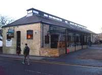 In 35 years of riding down East Street in cars, I missed this little gem, just a half block back; near Adam and Eve street, would you believe. Although this pub claims to be The Old Tram Depot, the building was actually the stables for the tram horses. The tramway had the unusual track gauge of 4 feet, and was only open from 1880 to 1914 (no, I wasn't there!). The only surviving tram is displayed in the Ipswich Museum of Transport, but there is a curved piece of track set in cobbles at a Cambridge museum.<br><br>[Ken Strachan 23/11/2012]