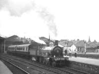 HR 103 stands at Inverness in August 1965 with the two preserved Caledonian coaches forming a return special to Forres. This was part of the shuttle service operated by the train between Inverness and Forres twice daily throughout that week as part of the Highland Railway centenary celebrations. <br><br>[K A Gray 14/08/1965]
