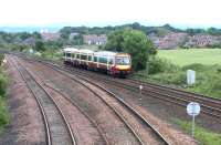 A westbound DMU in SPT livery passing Greenhill Lower Junction in June 2004.<br><br>[John Furnevel 15/06/2004]