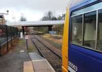 The view back towards Shildon from the platform end at Bishop Auckland. Heaton based Pacer 142022 is newly arrived from Saltburn and on a quick turn round for departure back there at 1325hrs. The points that form the start of the Weardale line are just beyond the bridge. <br><br>[Mark Bartlett 27/11/2012]