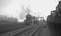 Gresley V2 2-6-2 no 60835 takes an up train past Stirling South shed on a murky March day in 1964.<br><br>[K A Gray 28/03/1964]