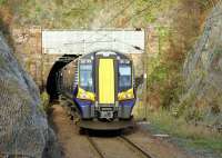 The 12.38 to Largs about to disappear into Fairlie Tunnel on 29 November 2012.<br><br>[Colin Miller 29/11/2012]