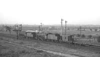 Stanier 2-8-0s, 48620+48622 alongside the site of the Midland Railway's Durranhill shed (closed November 1959) with a train of track panels off the Settle and Carlisle route in July 1967. The old NE Durranhill signal box stands on the left alongside the parallel Newcastle and Carlisle lines.<br><br>[K A Gray 07/10/1967]