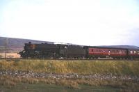 A relaxed looking crew member of Black 5 no 44671 takes in the scenery on a train ascending Shap in the mid 1960s.<br><br>[Robin Barbour Collection (Courtesy Bruce McCartney) //]