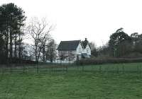 Temple Sowerby, between Penrith and Appleby, closed to passengers in 1953, nine years before the Stainmore line itself. This view shows the station house, now a private residence. The <I>Disused Stations</I> website also shows the station itself which is joined on to this building but not visible from the public road. (Map Reference NY613259). Nearby Kirby Thore station, closed on the same date, has not been so fortunate and disappeared completely when the A66 trunk road was realigned.  <br><br>[Mark Bartlett 27/11/2012]