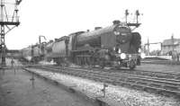 Schools class 4-4-0 no 30925 <I>'Cheltenham'</I> + Fowler 2P 4-4-0 no 40646 seen with a special during a water stop at Church Fenton on 13 May 1962. The train is the 1X50 RCTS <i>East Midlander No 5</I>, which is on its way from Nottingham Victoria to Darlington Bank Top.<br><br>[K A Gray 13/05/1962]