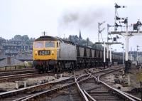 A special southbound merry-go-round coal train is brought through the closed station at Barrow Hill by Brush Type 4 No. 1994 in July 1971. The station here had originally been named Barrow Hill and Staveley Works but this was shortened in 1951, just three years before closure.<br><br>[Bill Jamieson 19/07/1971]