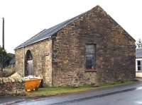 The surviving, partially refurbished goods shed at Broomlee, the station for West Linton, Peeblesshire. Photographed in December 2004 looking north east towards Leadburn. The station itself stood behind the camera on the south side of the B7059 Station Road [see image 32767]. Broomlee station closed to passengers as long ago as 1933, although the line north survived until 1960 after being utilised during WWII for 'military storage' purposes. <br><br>[John Furnevel 05/12/2004]