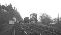 With the light almost gone on an overcast January afternoon in 1969, the 8.50am London St Pancras - Edinburgh Waverley (3.58pm ex-Carlisle) runs through Kershopefoot station heading for Newcastleton. The photograph is taken from the border crossing [see image 31037].   <br><br>[K A Gray 03/01/1969]