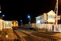 With barriers raised and road traffic again flowing behind the camera, a Class 156 Super Sprinter calls at Bare Lane on 7 December 2012 with a Morecambe to Lancaster service. Network Rail staff were carrying out the final work in preparation for the transfer of control of this section of line to Preston PSB after the last service on Saturday night, 8 December 2012. <br><br>[John McIntyre 07/12/2012]