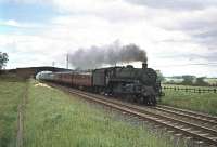 BR Standard class 5 4-6-0 no 73099 with an up train passing Plumpton, north of Penrith, in the 1960s. [See image 41265]<br><br>[Robin Barbour Collection (Courtesy Bruce McCartney) //]