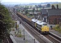 In 1971 Northamptonshire iron ore was still being supplied to steelworks on Teesside and this train heading north through the closed station at Barrow Hill, hauled by a pair of Brush Type 2s, is presumed to be such a working.  The line on the extreme left is the branch from Hall Lane Junction and Staveley Town.<br><br>[Bill Jamieson 17/07/1971]