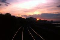 Cab view on an evening train from Wicklow heading towards the Dublin sunset in summer 1976. Earlier, at a pub near the Wicklow terminus, the photographer was rather taken aback to be asked to join the driver and guard for a pint, and then offered a cab ride back to the Fair City!<br><br>[David Spaven //1976]