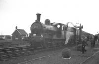 65033 takes water at Barnard Castle on 7 May 1960 during a stop on the RCTS J21 railtour.<br><br>[K A Gray 07/05/1960]