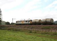 A featherweight load for Britain's most powerful locomotive. 92013 <I>'Puccini'</I> sails through Lamington with an up WCML freight, late one afternoon in September 2006.<br><br>[John Furnevel 01/09/2006]