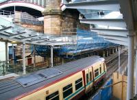 Work on the stairway and canopy over the former 'sub' platforms 8 & 9  alongside Waverley's south wall is now underway. View from the car park stairway on 12 December with a Helensburgh Central train waiting at platform 8.  <br><br>[John Furnevel 12/12/2012]