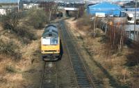 60048 <I>'Saddleback'</I> in the run round loop on the remaining section of Dewsbury's former Railway Street branch, after depositing loaded tanks in the adjacent Blue Circle Cement Depot [see image 26064].  <br><br>[David Pesterfield 25/02/1997]