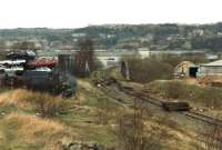 The end of the remaining section of Dewsbury's former Railway Street branch, with the headshunt beyond the Blue Circle Cement Depot run round and access loop seen on the right. The bridge over the Dewsbury branch off the Calder & Hebble Navigation is seen in centre of view, whilst Mill Street East overbridge can be seen beyond to upper right of view. [See image 41342].<br><br>[David Pesterfield 25/02/1997]