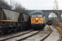 56090 runs through the exchange sidings for the British Oak Disposal Point towards the main line connection to run back and couple onto the rakes of loaded MGR wagons to its left. Photographed in February 1993 from an occupation crossing over the sidings providing access to Calder Grove cricket club. 22 years on from this view 56090 is now a Colas owned loco, and is presently at the Boden Rail Washwood Heath workshops; still in Fertis livery from working in France on hire from EWS.<br><br>[David Pesterfield 17/02/1993]