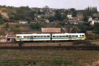 A class 141 Pacer in early West Yorkshire PTE green livery runs off the Huddersfield line eastbound spur in May 1987 to join the former L&Y main line to its next call at Mirfield. <br><br>[David Pesterfield 06/05/1987]