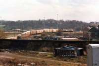 A view no longer possible from Wakefield Kirkgate station as an unidentified Railfreight liveried class 47 shunts a part rake of Greater Manchester Waste containers in the Witham Sidings. This was in March 1988, during the period when waste was being taken to the Welbeck landfill site near Normanton. <br><br>[David Pesterfield 29/03/1988]