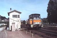 Then new SNCF <I>Tracteur</I> Y8057 trundles past a signalbox on the outskirts of Cherbourg in the summer of 1979. These diesel hydraulic shunting and trip locos were built from 1977 to 1990 and this particular example is still in service in 2012 based in Rouen. <br><br>[Mark Bartlett //1979]