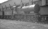 Withdrawn ex-LMS Class 2P 4-4-0 no 40635 'in store' alongside Llandudno Junction shed in April 1963. The locomotive was cut up at Cashmores, Great Bridge, 2 months later. <br><br>[K A Gray 01/04/1963]