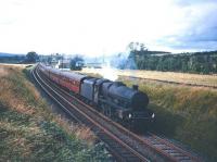 Jubilee no 45573 <I>Newfoundland</I> with the 12.40pm Gourock - Leicester 'CTAC Scottish Tours Express' near Langwathby on the Settle and Carlisle route in July 1965. [See image 29081] [With thanks to Messrs Jamieson, McRae, Greig and Smith] <br><br>[Robin Barbour Collection (Courtesy Bruce McCartney) 17/07/1965]