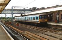 DMU 150105 in a variation of Regional Railways colours awaits its departure time from Platform 2 at Wakefield Westgate in June 1991. The train is one of the direct services operating at that time between Wakefield and Bangor. <br><br>[David Pesterfield 22/06/1991]