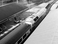 The final push-pull configuration on the Edinburgh - Glasgow shuttles utilised modified class 47 locomotives. This is no 47707 <I>'Holyrood'</I> photographed looking west from Waverley Bridge in 1984 awaiting departure time with an afternoon service to Glasgow Queen Street.<br><br>[John Furnevel 26/05/1984]