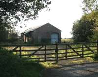 The surviving goods shed at Ganton, North Yorkshire, now used by the local farmer. View is west towards Malton, with the York - Scarborough line  running past the goods shed and over the level crossing off picture to the right. The long demolished station, effectively closed in 1930, stood on the east side of the crossing.<br><br>[John Furnevel 02/10/2008]