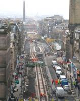 View south west along Shandwick Place from Princes Street West End on 12 December 2012 with temporary pedestrian 'bridges' crossing the tramworks at various points. Haymarket station stands in the background. In the centre of the picture work is progressing on the Shandwick Place tram stop. Note the crossover just beyond.<br><br>[John Furnevel 12/12/2012]