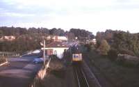 The station at Charlbury, Oxfordshire, with its notable 1853 wooden Italienate style building. View is south east towards Oxford in September 1985. The line here had been singled in 1971. It was redoubled in 2011.<br><br>[Ian Dinmore /09/1985]