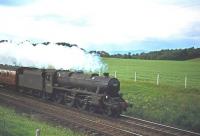 Black 5 no 45423 with an up train between Stirling and Larbert, photographed south of Plean in the 1960s.<br><br>[Robin Barbour Collection (Courtesy Bruce McCartney) //]