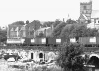 The northbound Chrysler company train photographed looking east across the remains of Carlisle's Viaduct Yard in the summer of 1972. The train has just passed through Carlisle station and is on its way to Linwood. [See image 6314]<br><br>[John Furnevel 22/08/1972]