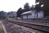 Looking across the running lines towards the old station at Limpley Stoke, on the Bath - Westbury route, in October 1996, approximately 30 years after closure. View is south west, with the River Avon behind the camera. [See image 38385]<br><br>[Ian Dinmore /10/1966]