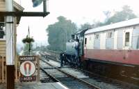 The fireman of small prairie tank 4566 leans out for the token as the train leaves for Bridgnorth in July 1979. <br><br>[Colin Miller /07/1979]