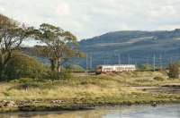 334036 skirts the Clyde at Ardmore as it heads east towards Glasgow on 22 September 2012. Although the photo features the north bank of the river in the foreground, the hills in the background are on the south shore above Langbank.<br><br>[John McIntyre 22/09/2012]