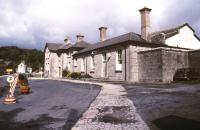 The road approach to Foynes station, Co Limerick, in July 1988. The station was closed to passenger traffic in February 1963 but freight traffic continued until the late 1990s [see image 33823]. The line from Limerick was 'mothballed' in 2001.<br><br>[Ian Dinmore 04/07/1988]