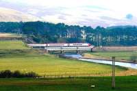 A Glasgow Central - London Euston Pendolino crosses the Clyde at Crawford in February 2005, just as the winter sun breaks through the clouds.<br><br>[John Furnevel 24/02/2005]