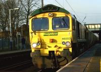 January is often a month when the sun doesn't come out too often. Happily, on 28 January 2012, it managed for an hour or two. Freightliner 66553 heads a loaded coal train south that day through Leyland with the yellow front of the locomotive lit up.<br><br>[John McIntyre 28/01/2012]