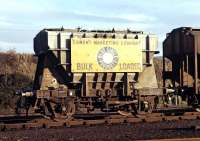 Looking just like the Airfix model which I had constructed a few years earlier, a Blue Circle cement branded Presflo basks in late autumn sunshine at Millerhill Yard in 1970.<br><br>[Bill Jamieson 22/11/1970]