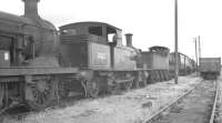 Adams 4-4-2 Radial Tank no 30582 features in a lineup of locomotives awaiting disposal at Eastleigh in August 1961. Built by Robert Stephenson & Hawthorn in 1885, the veteran had been withdrawn from Exmouth Junction a month before the photograph was taken.<br><br>[K A Gray 13/08/1961]