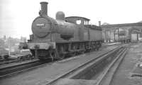 J25 0-6-0 no 65645 standing at the west end of Gateshead shed in the early 1960s. The veteran was withdrawn from here in April 1962. Note the Castle Keep in the background on the north side of the Tyne.<br><br>[K A Gray //]