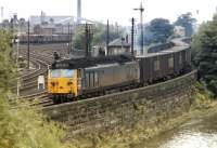 Class 50 No 429 and the 10.00 Linwood to Gosford Green car component containers service look quite out of place at Dentonholme South Junction on the Carlisle good avoiding lines in a scene which could otherwise have been taken in the 1950s rather than August 1971. Dentonholme Goods in the background still seems to be doing reasonable business at that time.<br><br>[Bill Jamieson 16/08/1971]